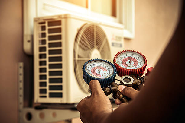 Professional Heat Pump Repair technician working in Salem, NH